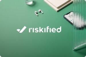 Riskified logo on a green desk banner